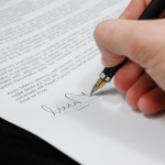 hand signing a contract